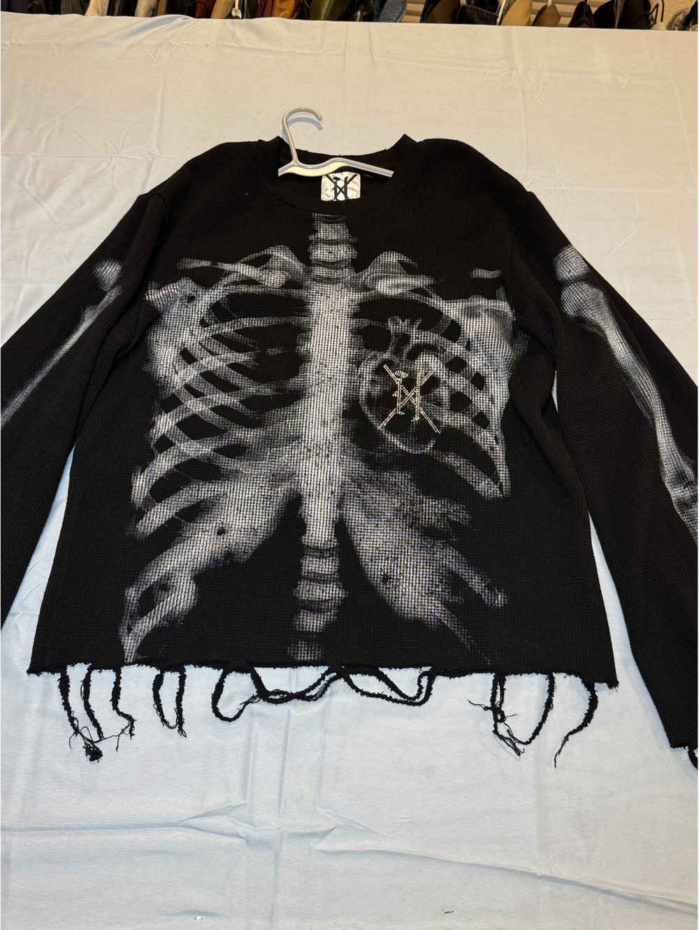Black skeleton distressed knit sweater